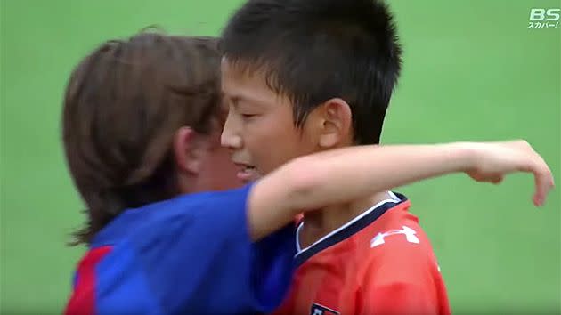 Hugs all around after Barcelona U/12s beat Japanese side in Tokyo.