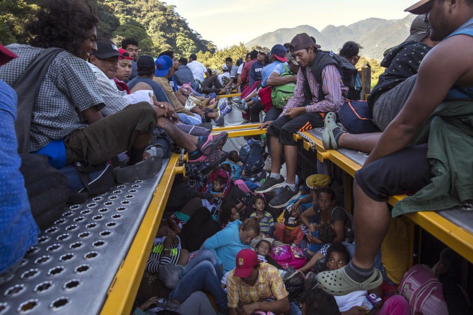 Central American migrants, part of a thousands-strong caravan hoping to reach the U.S. border, get a lift on a truck as they leave Cordoba, Veracruz state, Mexico, on Nov. 5, 2018. (Photo: Rodrigo Abd/AP)