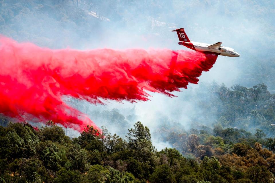 PHOTO: An air tanker drops retardant while trying to stop the Thompson Fire from spreading in Oroville, Calif., July 3, 2024.  (Noah Berger/AP)