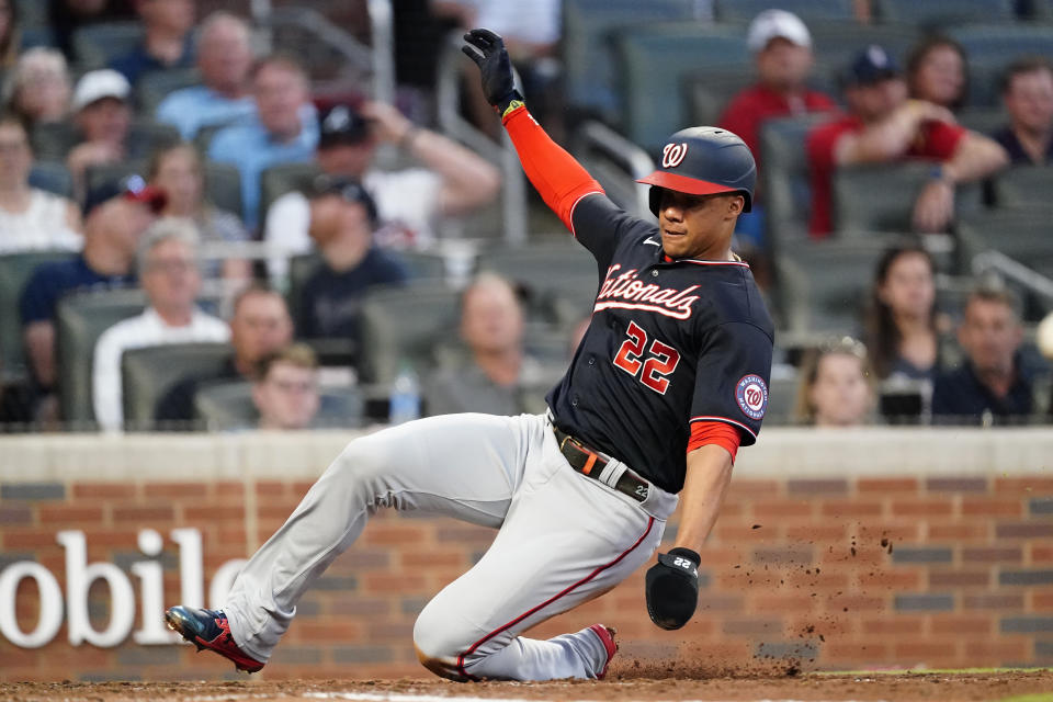 Washington Nationals' Juan Soto scores on a Kyle Schwarber base hit in the third inning of a baseball game Tuesday, June 1, 2021, in Atlanta. (AP Photo/John Bazemore)
