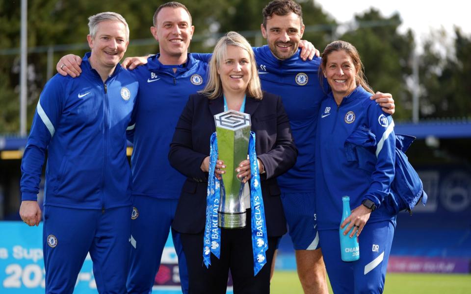 Chelsea manager Emma Hayes and her back room staff celebrate with the FA Women's Super League trophy  - PA