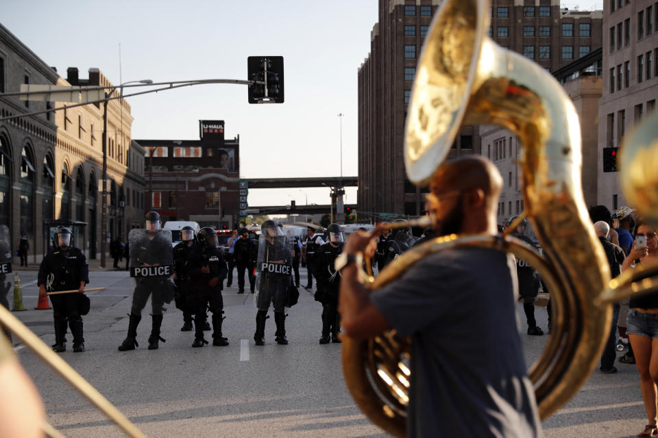 <p>Chris Tomlin plays a sousaphone as protesters gather, Friday, Sept. 15, 2017, in downtown St. Louis, after a judge found a white former St. Louis police officer, Jason Stockley, not guilty of first-degree murder in the death of a black man, Anthony Lamar Smith, who was fatally shot following a high-speed chase in 2011. (Photo: Jeff Roberson/AP) </p>