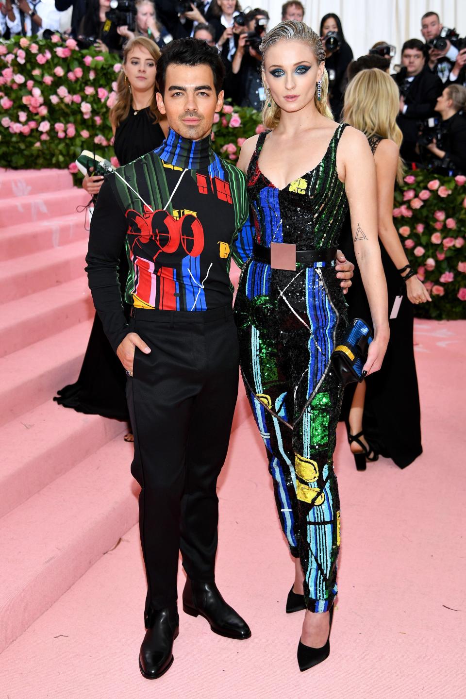 She stars on one of our favorite shows (Game of Thrones), she just got married to a boy bander (Joe Jonas), and now, Sophie Turner is looking like she's ready to save the day at the 2019 Met Gala. The actress and newlywed popped up on the pink carpet in a custom Louis Vuitton look, which, according to her stylist Kate Young, was meant to give off "a superhero vibe."