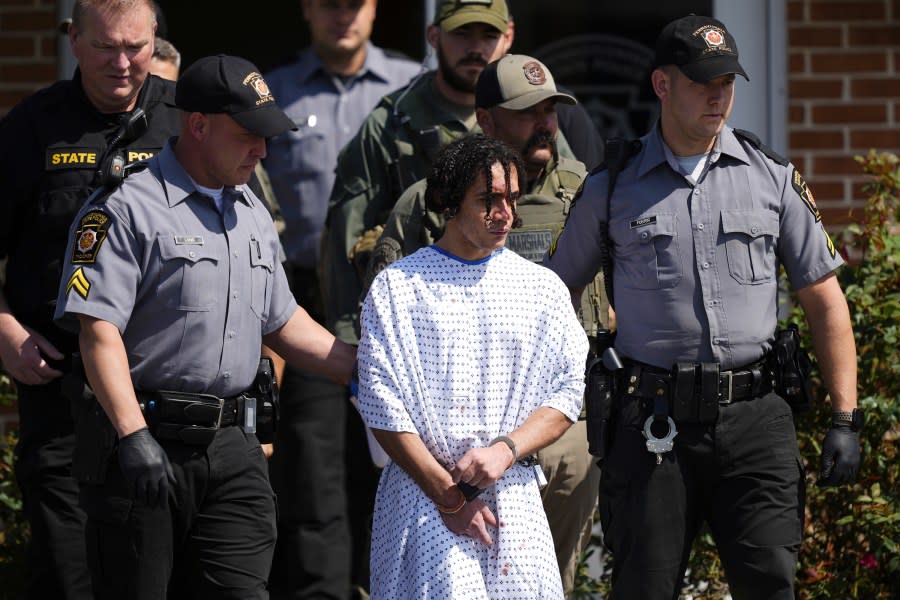 Law enforcement officers escort Danelo Cavalcante from a Pennsylvania State Police barracks in Avondale Pa., on Wednesday, Sept. 13, 2023. Cavalcante was captured Wednesday after eluding hundreds of searchers for two weeks. (AP Photo/Matt Rourke)