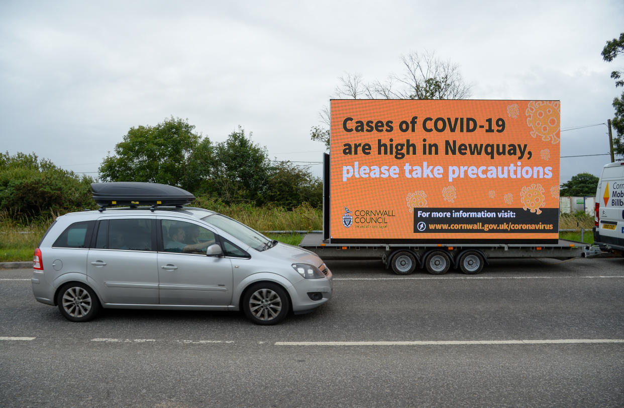 NEWQUAY, ENGLAND - JULY 29: A mobile Cornwall council billboard stating that cases of COVID-19 are high in Newquay is seen on July 29, 2021 in Newquay, United Kingdom. (Photo by Finnbarr Webster/Getty Images)