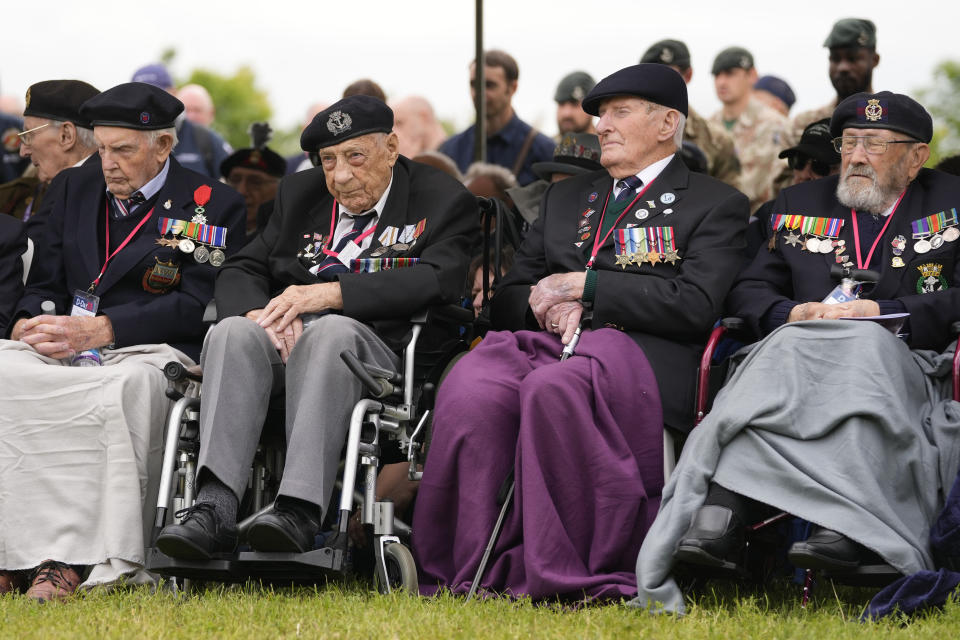 British World War II veterans attend a service at the Pegasus Bridge memorial in Benouville, Normandy, France, Wednesday, June 5, 2024. World War II veterans from across the United States as well as Britain and Canada are in Normandy this week to mark 80 years since the D-Day landings that helped lead to Hitler's defeat. (AP Photo/Virginia Mayo)