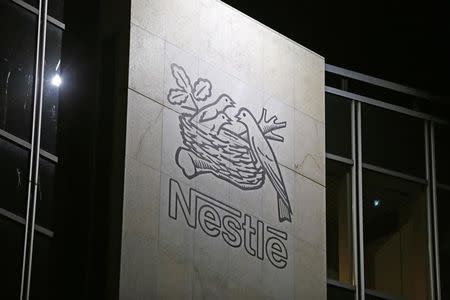 FILE PHOTO: The Nestle logo is pictured on the company headquarters building in Vevey, Switzerland February 18, 2016. REUTERS/Pierre Albouy