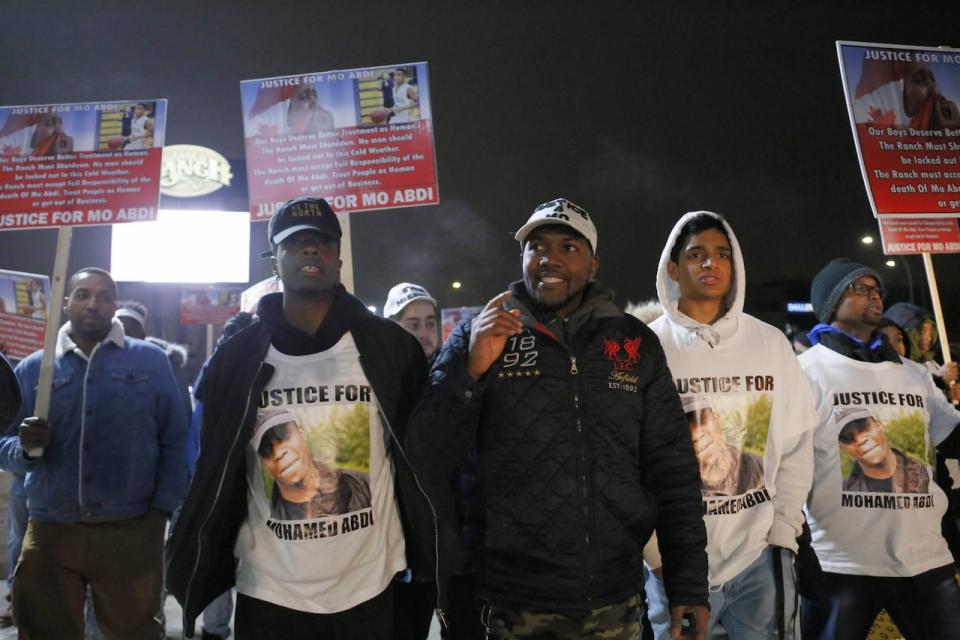 People gathered outside the Ranch Roadhouse in south Edmonton on Friday night, demanding the bar shutdown after the death of Mohamed Abdi.