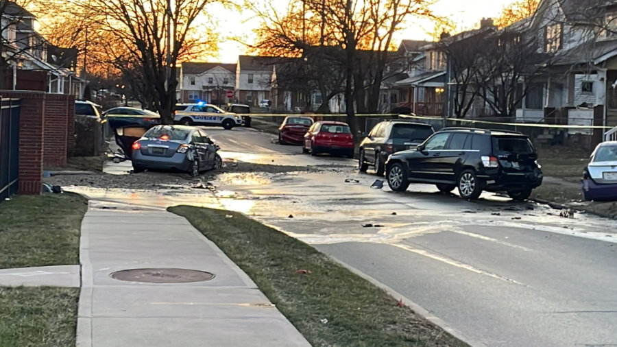 Police on scene at the 900 block of East 11th Avenue after fatal shooting suspects crash their getaway car and cause a water main break. (NBC4/Drew Yaussy)