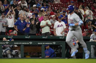 Mets fans applaud as New York Mets' Pete Alonso rounds the bases after hitting a solo home run during the ninth inning of a baseball game against the St. Louis Cardinals Tuesday, May 7, 2024, in St. Louis. (AP Photo/Jeff Roberson)