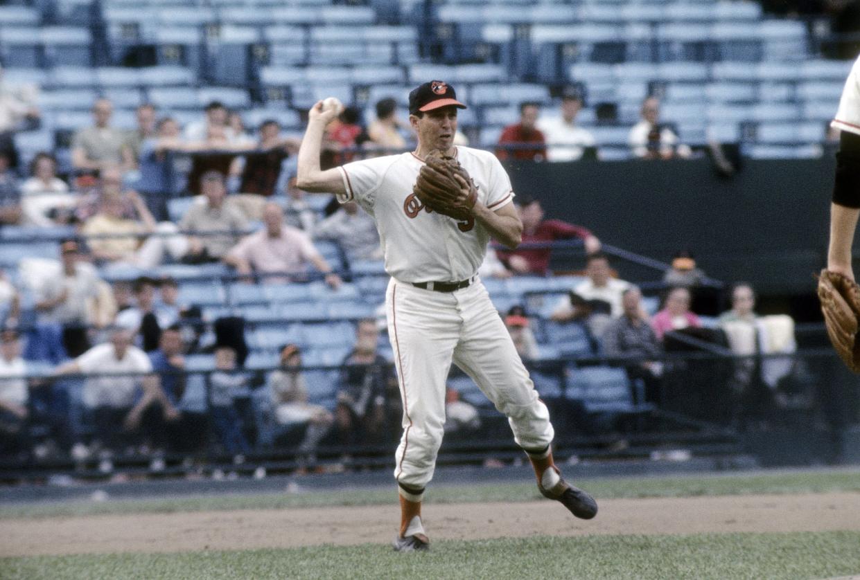 BALTIMORE, MD - CIRCA 1970's: Third baseman Brooks Robinson #5 of the Baltimore Orioles in action at third base set to make a throw during a Major League Baseball game circa 1970's at Memorial Stadium in Baltimore, Maryland. Robinson played for the Orioles from 1955-77. (Photo by Focus on Sport/Getty Images)