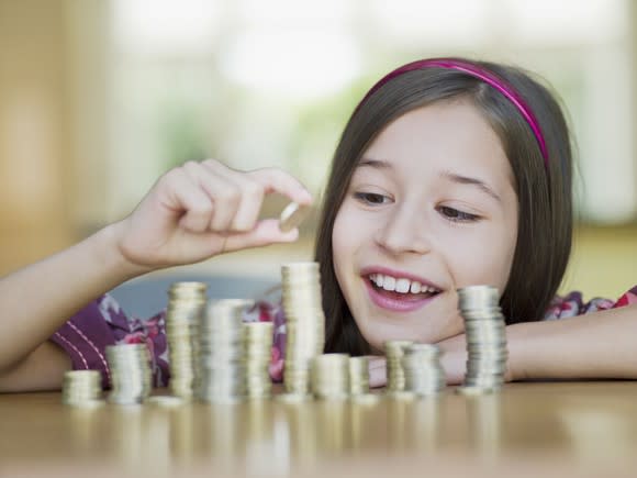 Girl stacking coins