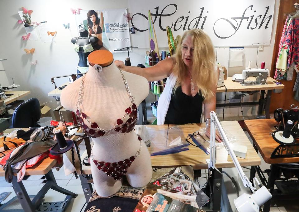 Swimwear designer Heidi Fish talks about her inspiration for a bikini made out of guitar picks, at her home studio in Bremerton on Thursday, June 22, 2023.