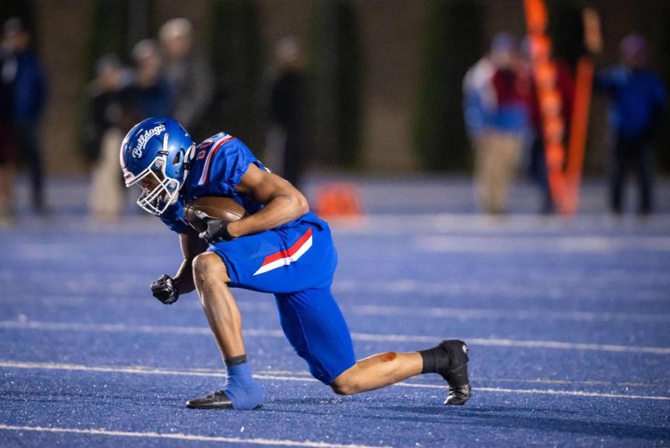 Folsom Bulldog wide receiver Brian Ray III (80) celebrates while getting up after catching a deep pass from quarterback Austin Mack (12) during the third quarter against Central Catholic of Modesto at the CIF Sac-Joaquin Section Division I high school football playoff semifinal game Friday, Nov. 18, 2022, at Folsom High School. Folsom beat Central Catholic, 62-27.