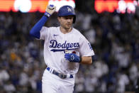 FILE - Los Angeles Dodgers' Trea Turner celebrates as he runs the bases on a solo home run against the San Diego Padres during the third inning in Game 2 of a baseball NL Division Series, Wednesday, Oct. 12, 2022, in Los Angeles. The Philadelphia Phillies landed Trea Turner on Monday, Dec. 5, 2022, agreeing to a $300 million, 11-year contract with the dynamic shortstop. (AP Photo/Mark J. Terrill, File)