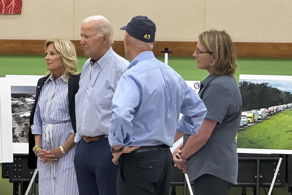 President Joe Biden stands with first lady Jill Biden, left, Sen. Rick Scott, R-Fla., second from right, and Federal Emergency Management Agency administrator Deanne Criswell, right, during a briefing at Suwannee Pineview Elementary School, Saturday, Sept. 2, 2023, in Live Oak, Fla. President Biden traveled to Florida to survey damage caused by Hurricane Idalia. (AP Photo/Will Weissert)