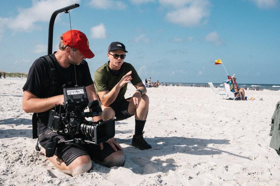 Members of Kennetic Productions film crew get footage at the beach.