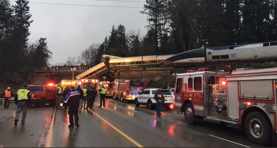 <p>A derailed train falls onto I-5 South in Olympia, WA. (Photo: Trooper Brooke Bova‏/Wash St. Patrol) </p>