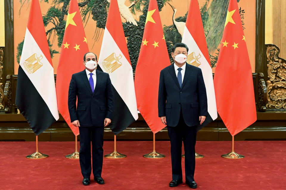 In this photo provided by China's Xinhua News Agency, Chinese President Xi Jinping, right, meets with Egyptian President Abdel Fattah el-Sisi at the Great Hall of the People in Beijing, China, Saturday, Feb. 5, 2022. (Shen Hong/Xinhua via AP)