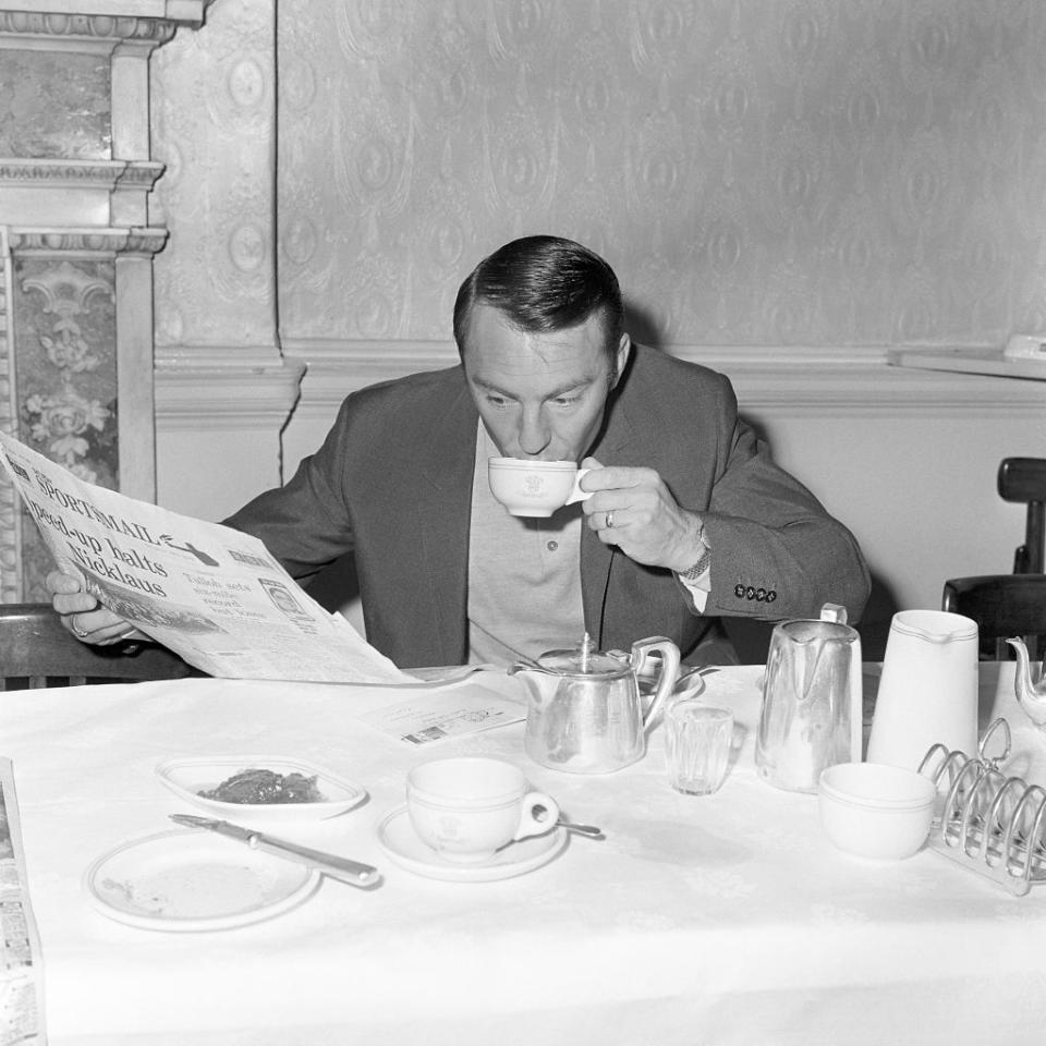 Jimmy Greaves reads a newspaper at the England team hotel during the 1966 World Cup (PA) (PA Archive)