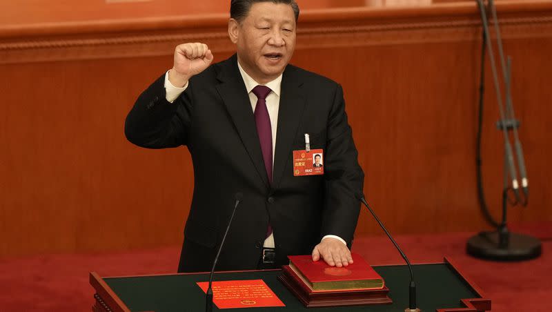Chinese President Xi Jinping takes his oath after he is unanimously elected as president during a session of China’s National People’s Congress at the Great Hall of the People in Beijing, Friday, March 10, 2023. Xi was awarded a third five-year term as president on Friday, putting him on track to stay in power for life.
