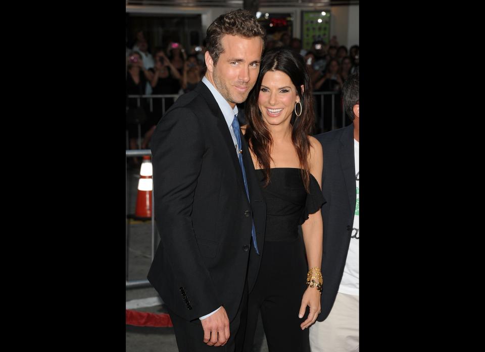 LOS ANGELES, CA - AUGUST 01:  Actors Ryan Reynolds (L) and Sandra Bullock arrive at the premiere of Universal Pictures' 'The Change-Up' held at the Regency Village Theatre on August 1, 2011 in Los Angeles, California.  (Photo by Jason Merritt/Getty Images)