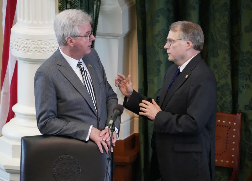 Sen. Brian Birdwell, R-Granbury, right, who led the committee to create the rules for the impeachment trial of suspended Attorney General Ken Paxton, talks to Lt. Gov. Dan Patrick in the Senate chamber in June.