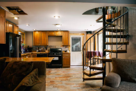 <p>Make a quick escape via the spiral staircase in the kitchen. (Airbnb) </p>
