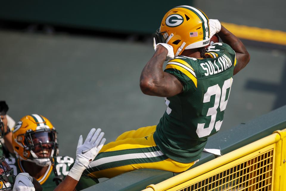 Green Bay Packers' Chandon Sullivan celebrates his interception and touchdown return during the second half of an NFL football game against the Detroit Lions Sunday, Sept. 20, 2020, in Green Bay, Wis. (AP Photo/Matt Ludtke)