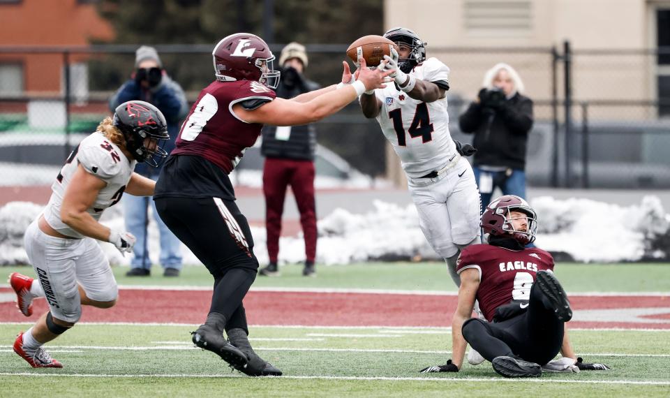 The former Lena-Winslow star Marey Roby, No. 14, lunges for an interception for North Central College during a game against the University of Wisconsin-La Crosse in the NCAA Division III national quarterfinals on Dec. 2, 2023, in La Crosse, Wisconsin.