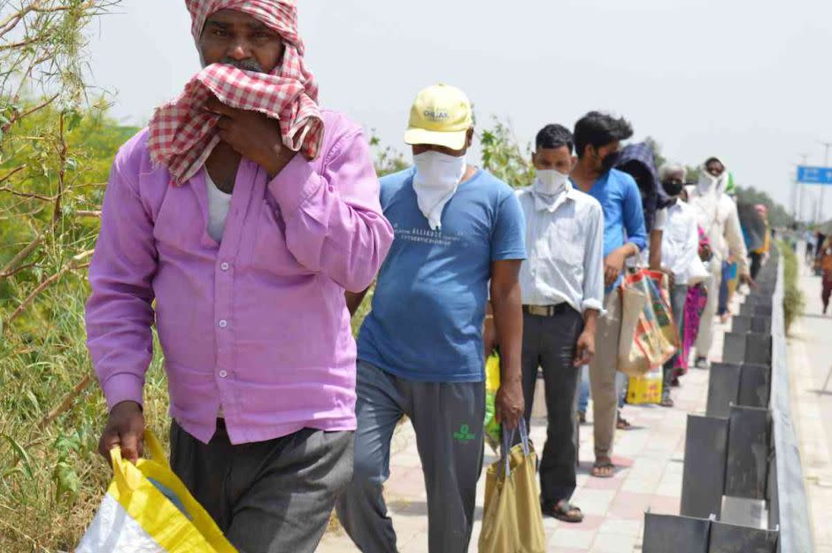 A photograph taken in April 2020: A two-km long food queue in Delhi. 