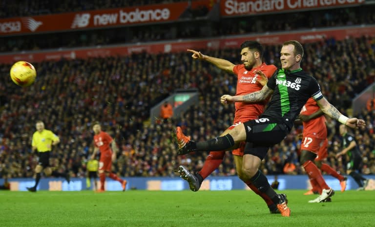 Liverpool's midfielder Emre Can (L) vies with Stoke City's midfielder Glenn Whelan during the English League Cup semi-final second leg football match at Anfield in Liverpool, England, on January 26, 2016