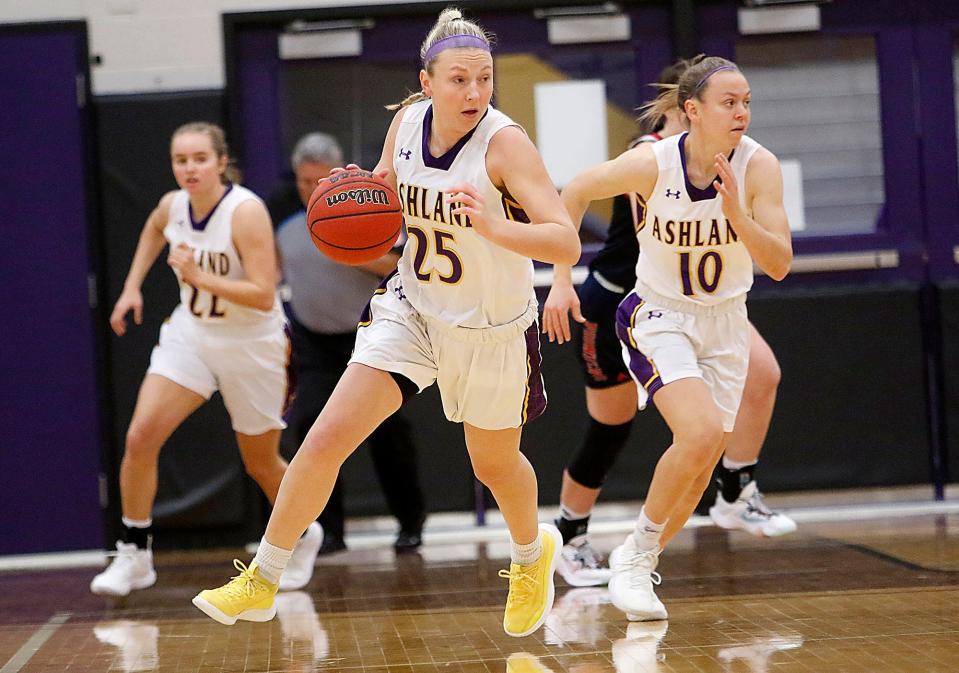 Ashland University's Karlee Pireu (25) brings the ball down court against Malone University during college women's basketball action Wednesday, Dec. 29, 2021 at Kates Gymnasium. TOM E. PUSKAR/TIMES-GAZETTE.COM