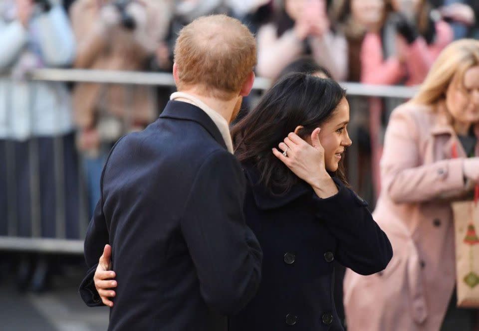 Meghan's first few official royal outings have seen her reach for her locks a lot. Source: Getty
