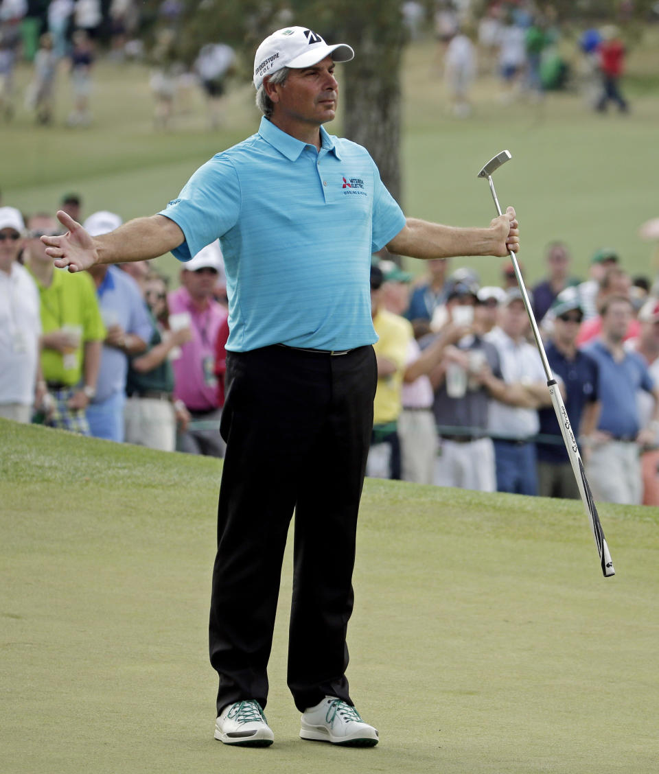 Fred Couples reacts after missing a birdie putt on the seventh green during the fourth round of the Masters golf tournament Sunday, April 13, 2014, in Augusta, Ga. (AP Photo/Chris Carlson)