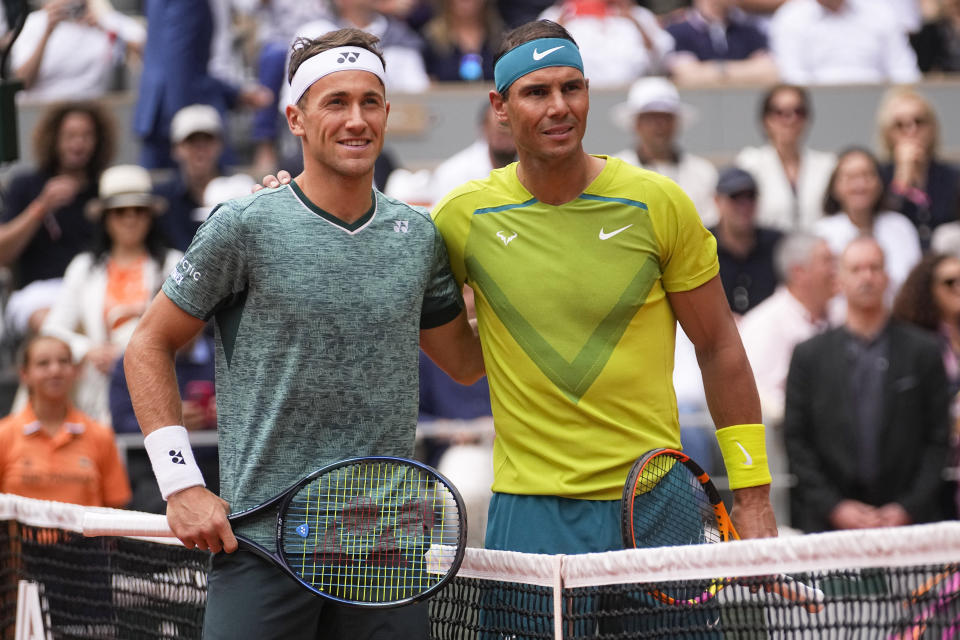 Norway's Casper Ruud, left, and Spain's Rafael Nadal pose at the net prior to the men's final match at the French Open tennis tournament in Roland Garros stadium in Paris, France, Sunday, June 5, 2022. (AP Photo/Michel Euler)