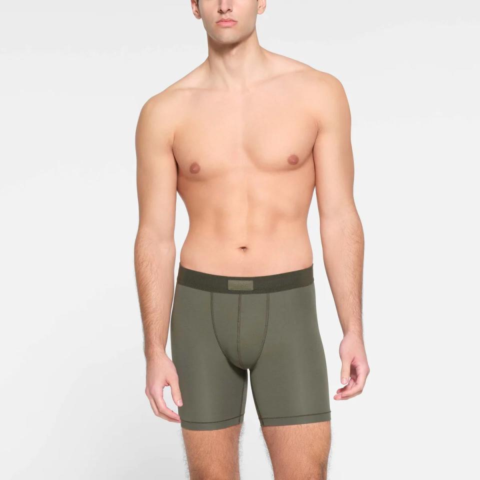 model wearing 5-inch green boxer briefs