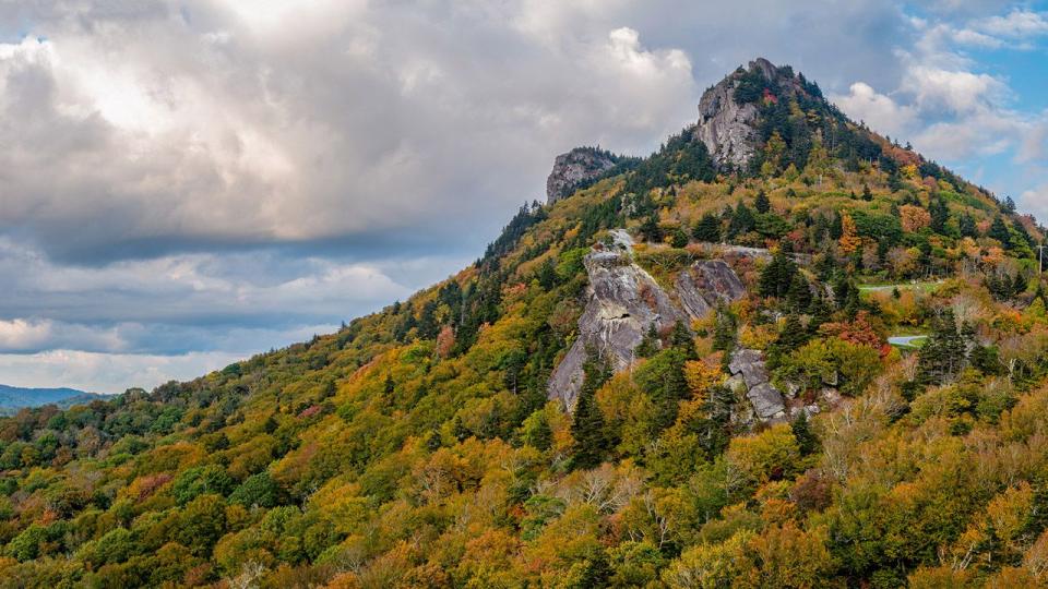 Oct. 5, 2023: Fall color is filling the landscape of Grandfather Mountain's upper reaches, as seen in this image looking up at Linville and Morton Peaks.
While there is still a lot of green on the mountain, the transition to autumn hues is progressing from one day to the next. Colder temperatures are expected to move in this weekend and may cause the process to quicken.