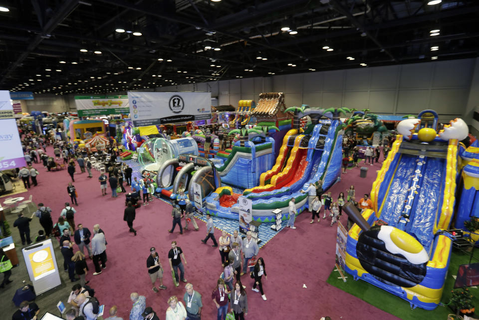 Hundreds of exhibitors with various products relating to the amusement industry display their products at the International Association of Amusement Parks and Attractions convention Tuesday, Nov. 19, 2019, in Orlando, Fla. (AP Photo/John Raoux)