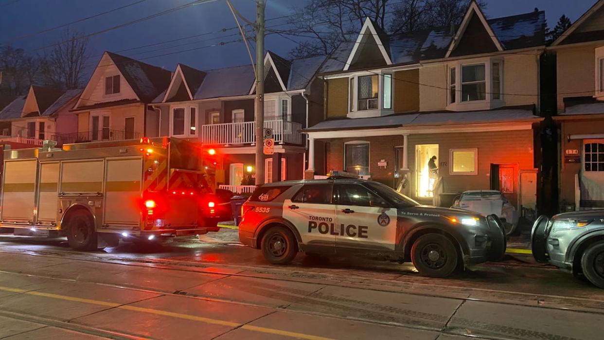 Toronto firefighters and police at the scene of a fatal fire in the east end. (Paul Smith/CBC - image credit)