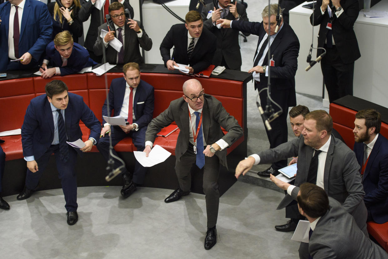 Traders during an open outcry trading session in 'The Ring' at the London Metal Exchange in London. Photo: Matt Crossick/EMPICS PA