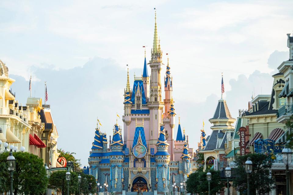 A new crest honoring the 50th anniversary of Walt Disney World Resort adorns Cinderella Castle at Magic Kingdom Park in Lake Buena Vista, Fla