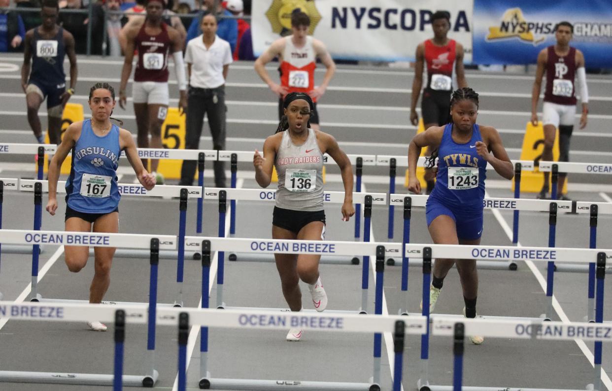 Elena Olson from The Ursuline School, left and Nya Thomas from North Rockland compete in the girls 55 meter hurdles at the 2024 New York State Indoor Track and Field Championships at the Ocean Breeze Athletic Complex in Staten Island, March 2, 2024.