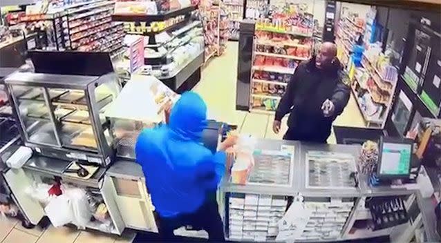 Two hooded thieves enter the store and jump over the front counter, threatening the attendant. Source: Fox 6