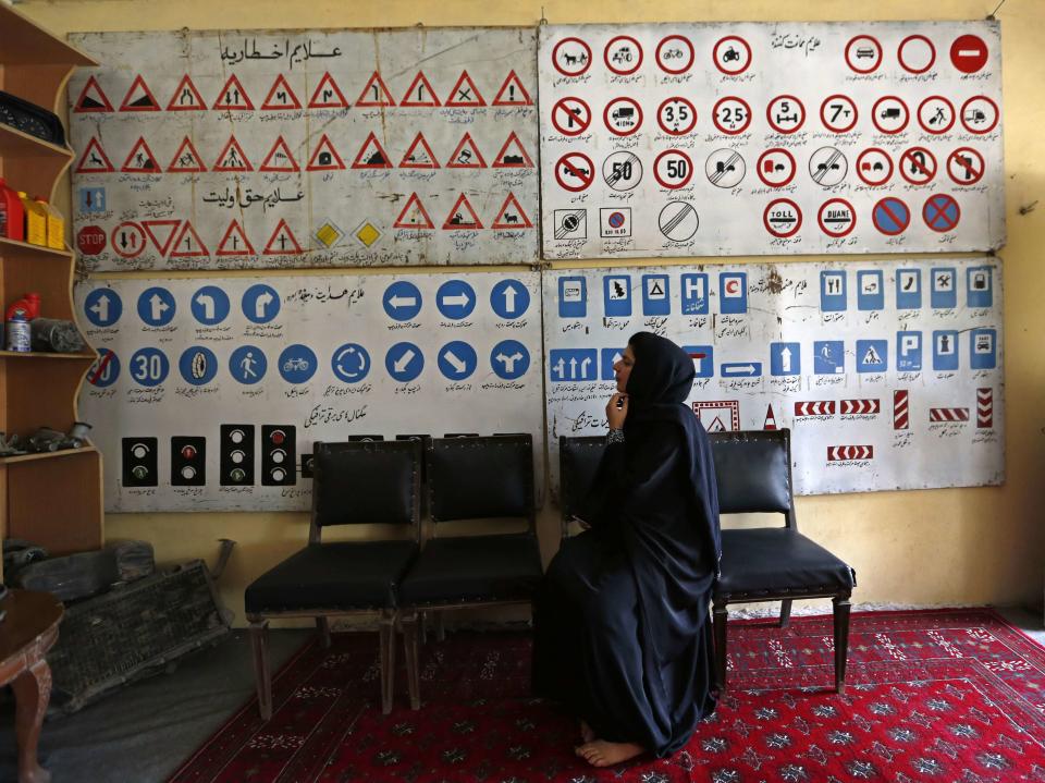 A women attends a class at a driving school in Kabul