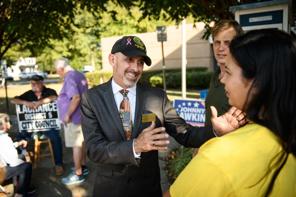 Mayoral candidate Freddie de la Cruz campaigns outside the Kiwanis Recreation Center on Tuesday, Oct. 10, 2023.