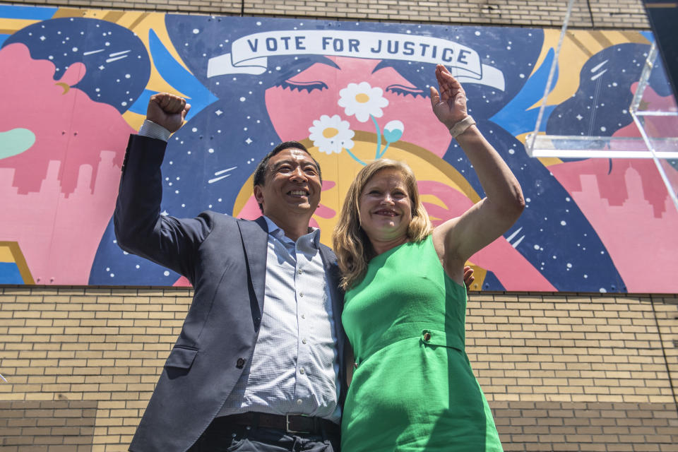 Mayoral candidates Andrew Yang and Kathryn Garcia wave to New Yorkers after speaking at the AAPI Democracy Project's 