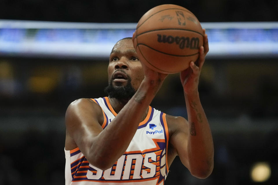 Phoenix Suns forward Kevin Durant takes a free throw during the first half of an NBA basketball game against the Chicago Bulls, Wednesday, Nov. 8, 2023, in Chicago. (AP Photo/Erin Hooley)