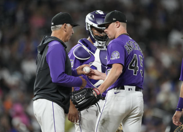 Martinez helps power Dodgers past Rockies 14-3 after severe weather delay