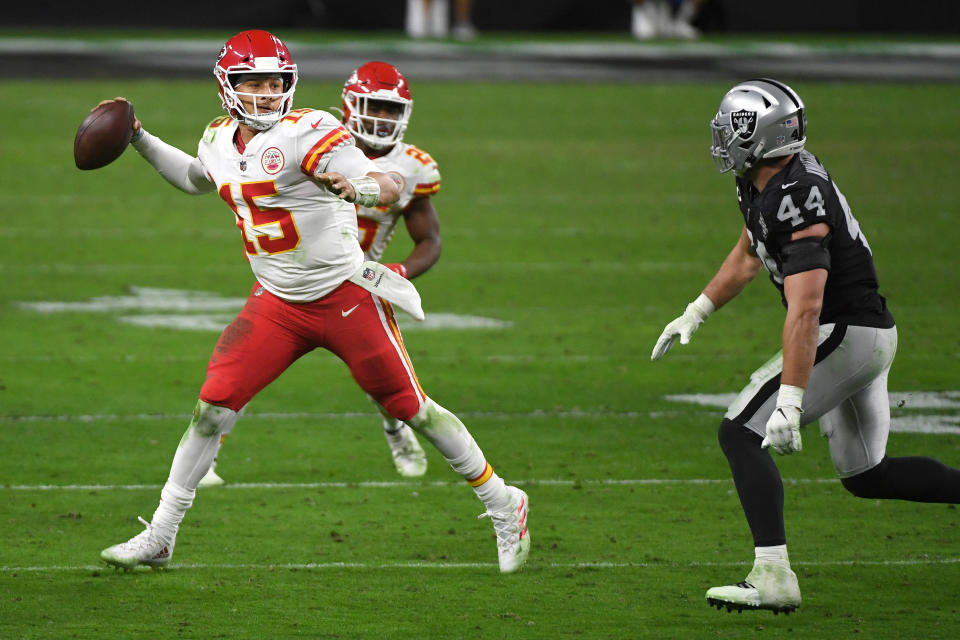 Kansas City Chiefs quarterback Patrick Mahomes passes the ball as inside linebacker Nick Kwiatkoski of the Las Vegas Raiders defends during the second half of an NFL game at Allegiant Stadium in Las Vegas, Nevada on Sunday.